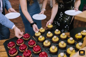   At Elfrather Muehle in Krefeld, NRW, Germany, guests enthusiastically dive into slices of cake all at once, adding energy and fun to the dessert hour.